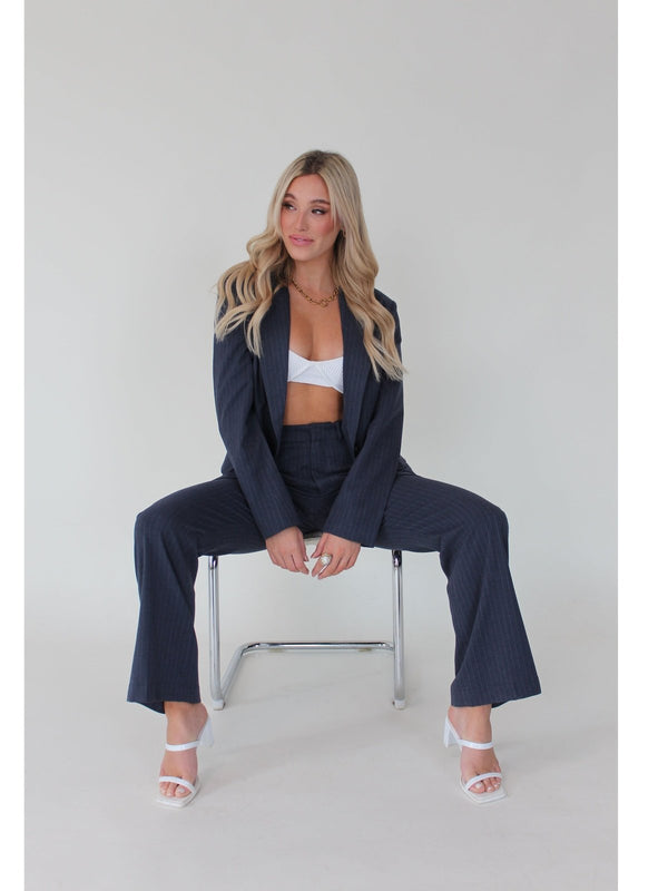 Navy blue pinstripe women's suit pants - Stylish and versatile, these pants offer comfort with a stretch waistband. Ideal for work or a night out, effortlessly blending sophistication with ease.