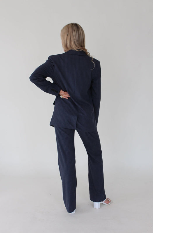 Navy blue pinstripe women's suit pants - Stylish and versatile, these pants offer comfort with a stretch waistband. Ideal for work or a night out, effortlessly blending sophistication with ease.