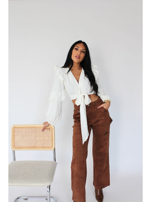 A Line and Dot tie-front white long sleeve blouse - Elevate your style with this chic piece featuring ruffle details on the sleeve. Effortlessly stylish and perfect for any occasion
